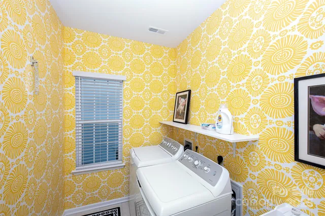 a bathroom with a sink a mirror and a shower curtain