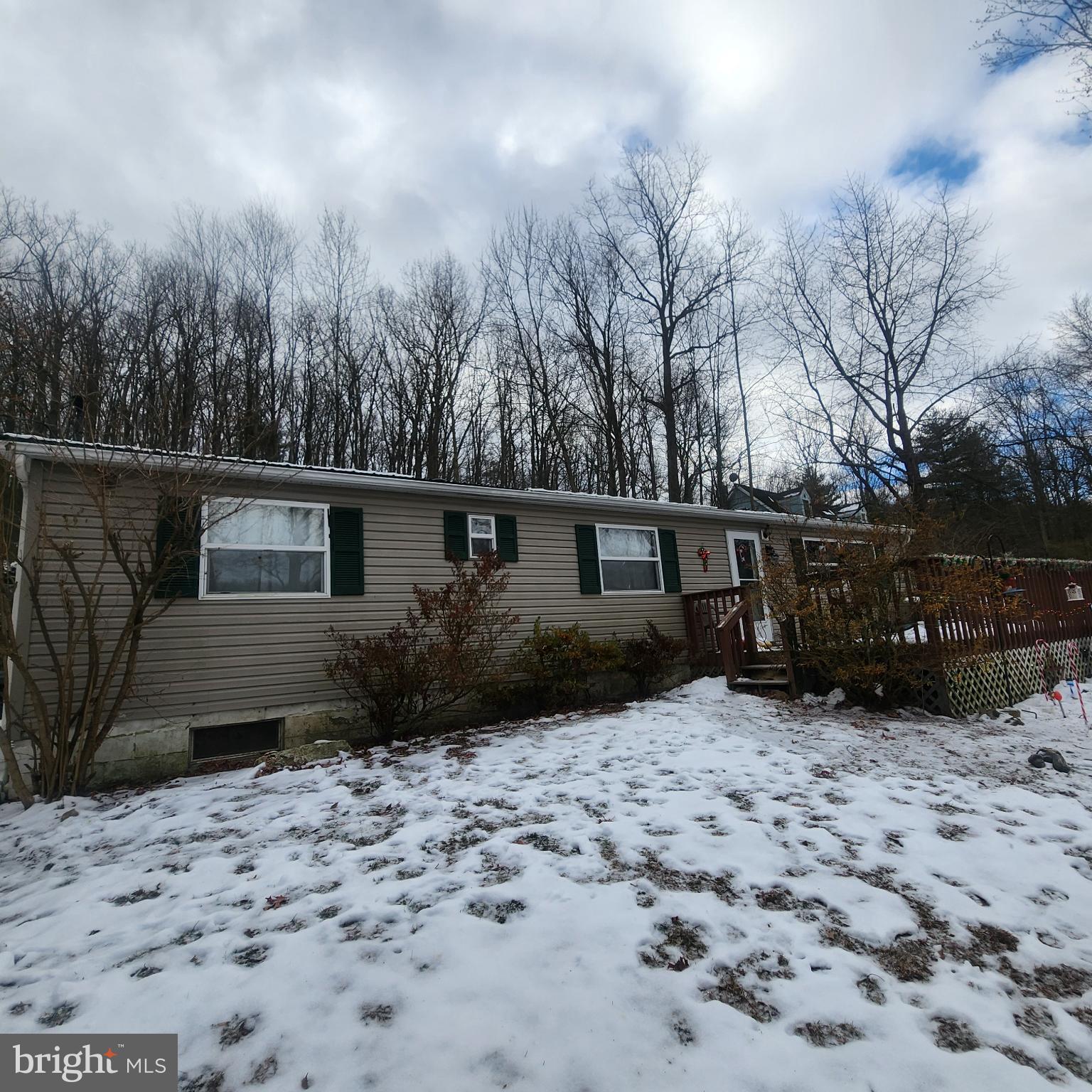 749 Clouser Hollow Road New Bloomfield, PA 17068 - Photo 1 of 30 a view of a house with a yard covered in snow