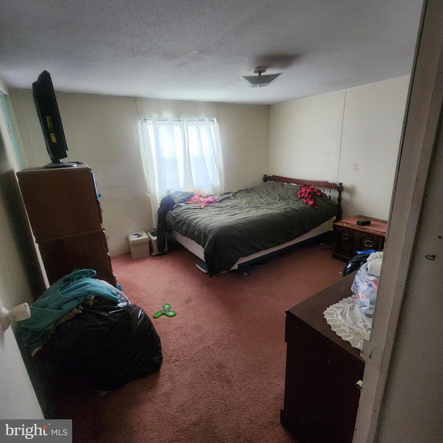 749 Clouser Hollow Road New Bloomfield, PA 17068 - Photo 13 of 30 a bedroom with a bed and window