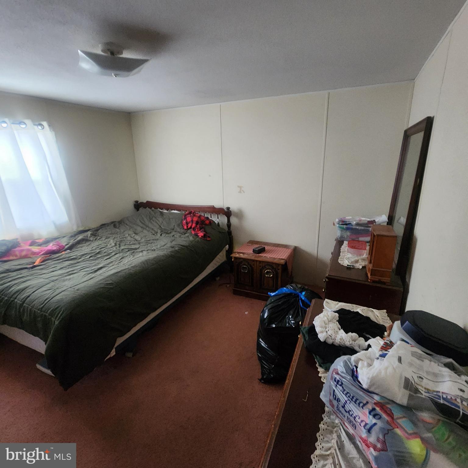 749 Clouser Hollow Road New Bloomfield, PA 17068 - Photo 14 of 30 a bedroom with a bed and wooden floor