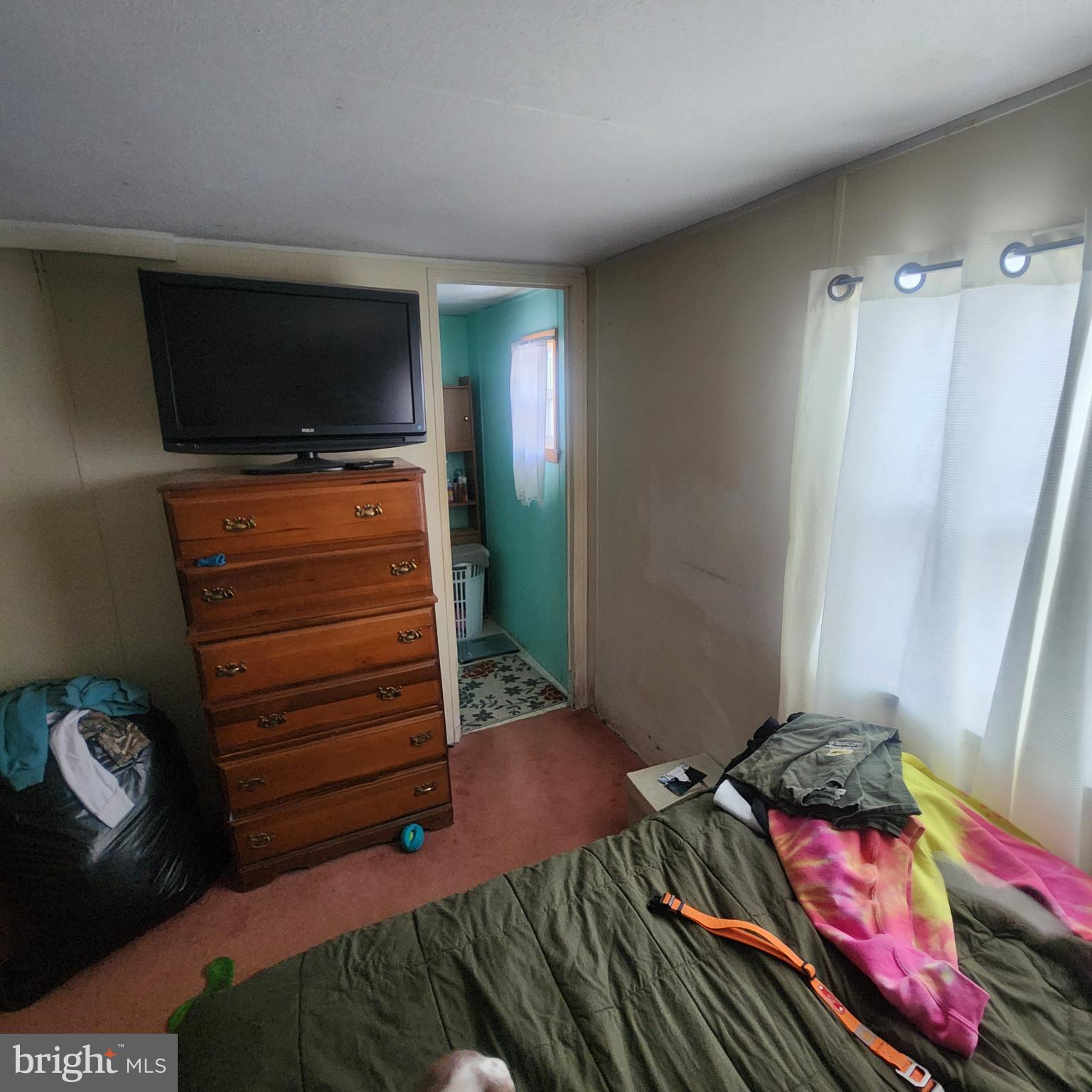 749 Clouser Hollow Road New Bloomfield, PA 17068 - Photo 17 of 30 a living room with furniture and a flat screen tv