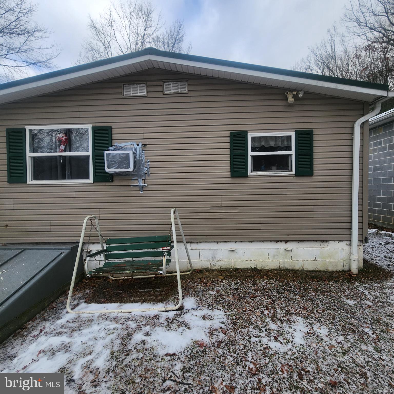 749 Clouser Hollow Road New Bloomfield, PA 17068 - Photo 23 of 30 a view of a house with a yard and wooden fence