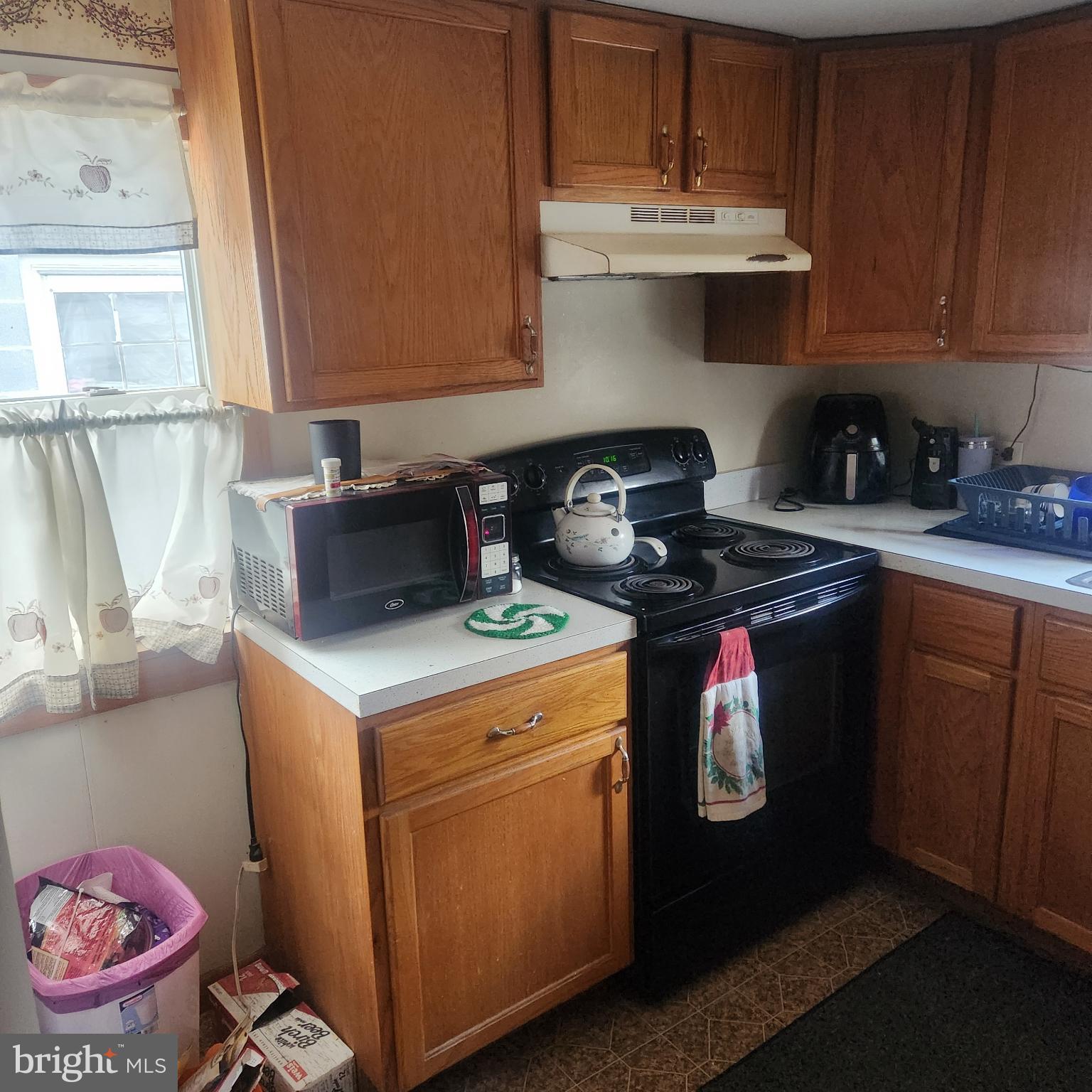 749 Clouser Hollow Road New Bloomfield, PA 17068 - Photo 6 of 30 a kitchen with a stove and cabinets