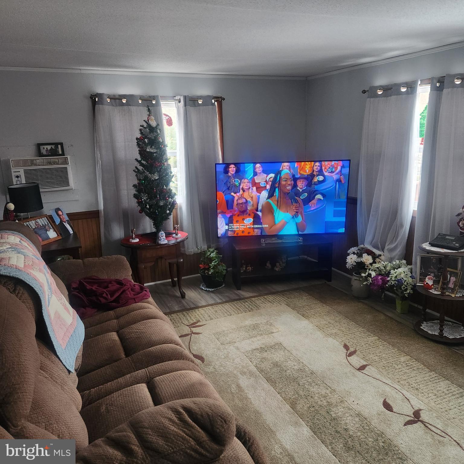 749 Clouser Hollow Road New Bloomfield, PA 17068 - Photo 9 of 30 a living room with furniture a flat screen tv and a couch