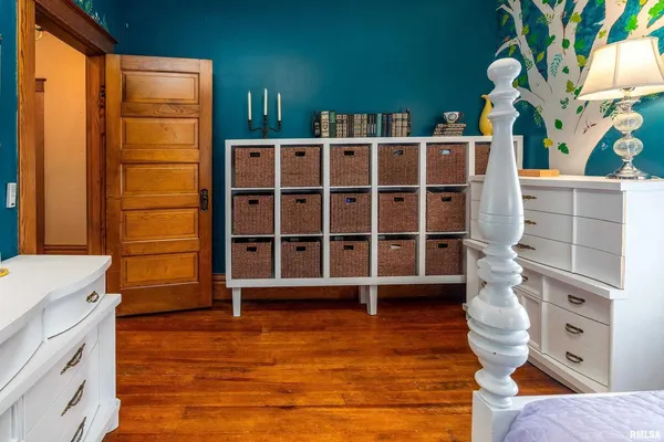 a bedroom with a bed and a closet