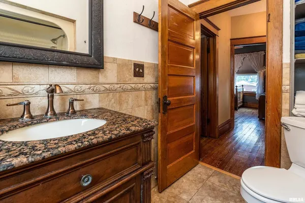 a bathroom with a sink a mirror and a bathtub