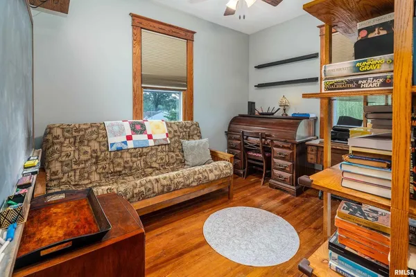 a room with lots of books and a book shelf
