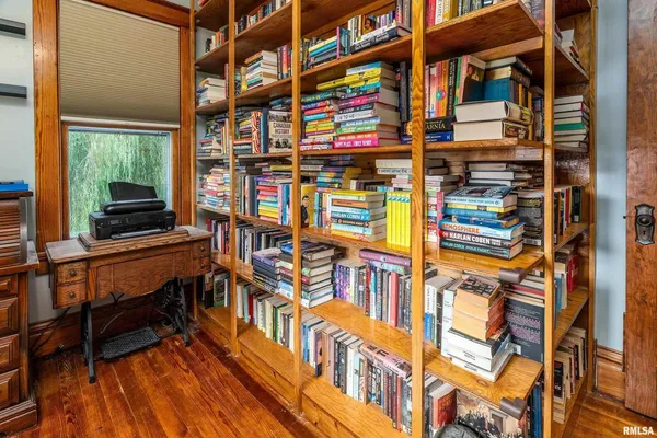 a view of work space with furniture and a bookshelf