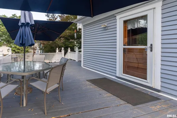 a view of a backyard with sitting area