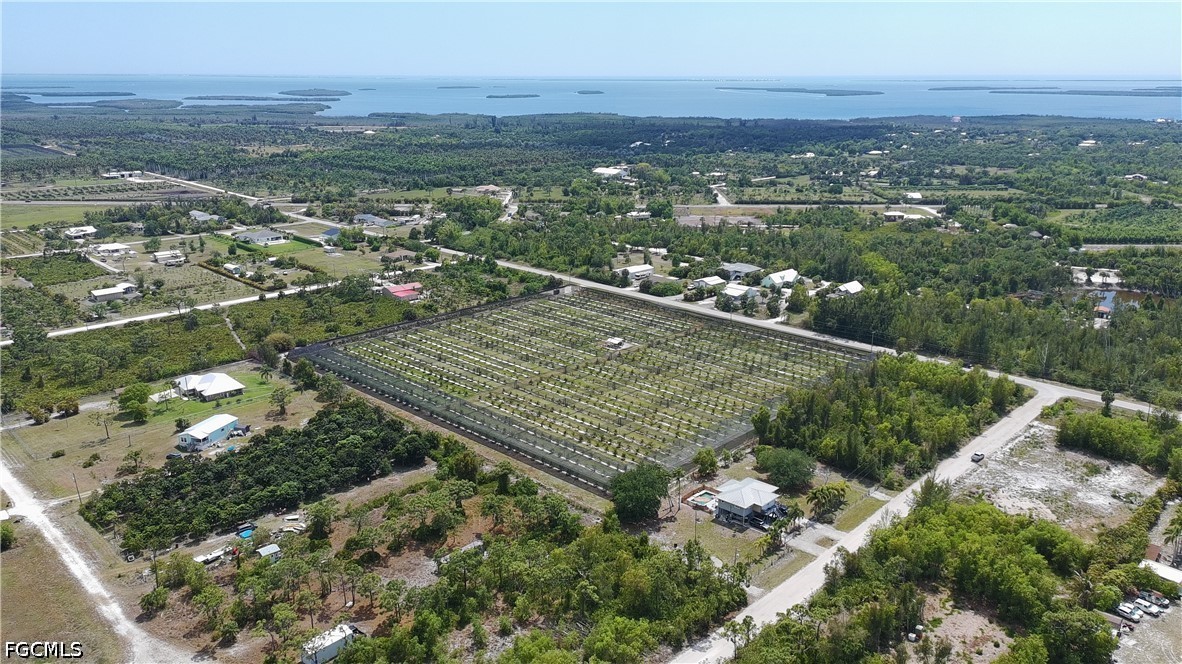 6430 Mannheim Road Bokeelia, FL 33922 - Photo 5 of 9 an aerial view of residential houses with outdoor space and trees
