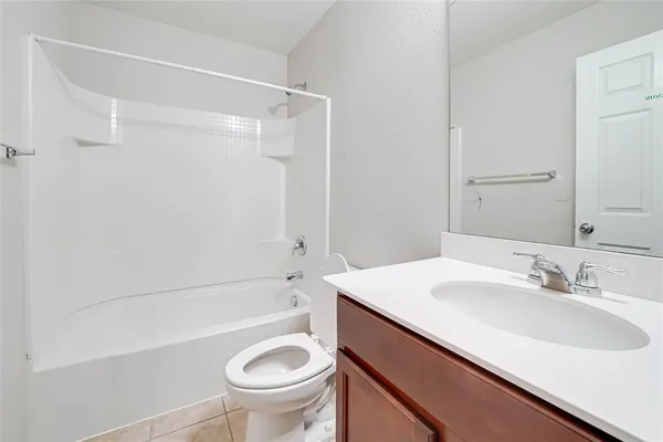 a bathroom with a sink a toilet and a bathtub