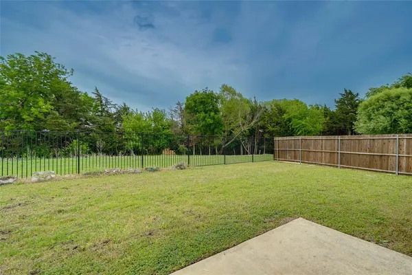 a backyard of a house with lots of green space