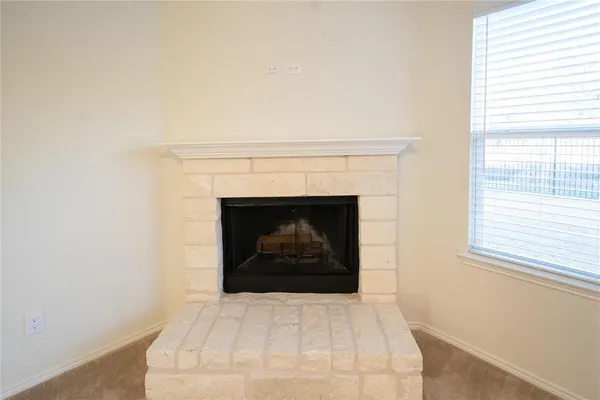 a white building with a fireplace