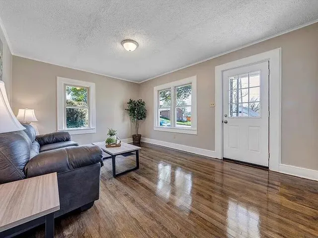 a living room with furniture and a window