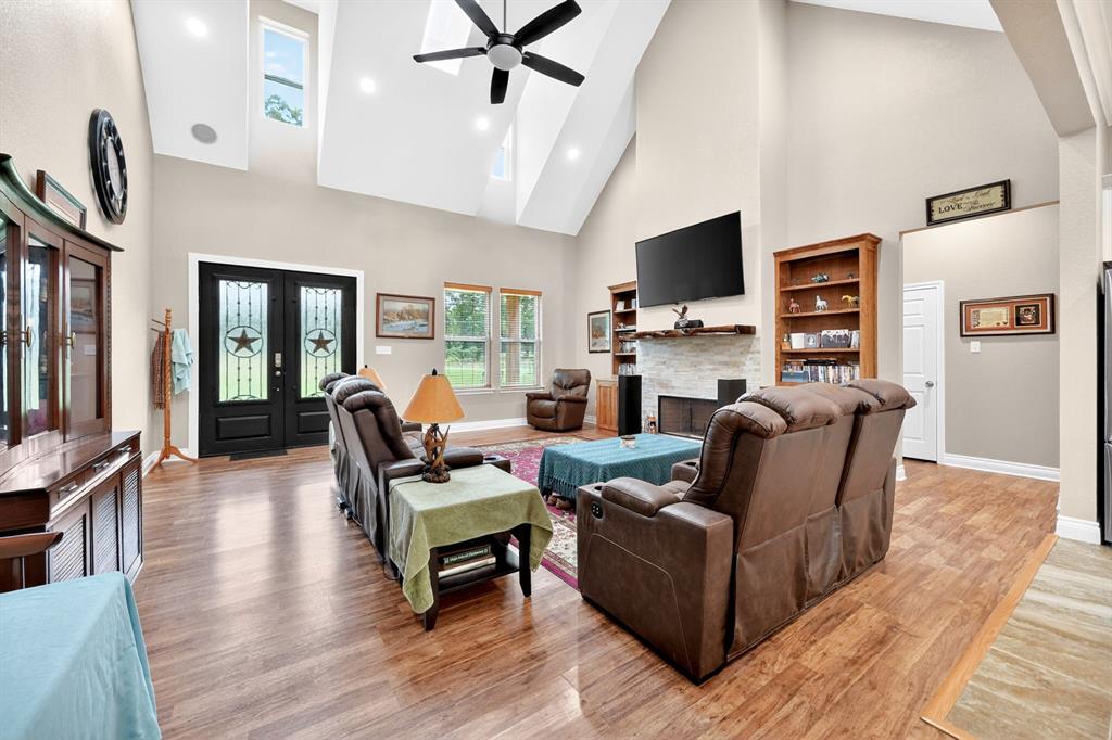 5230 Esquire Estates Road Mabank, TX 75156 - Photo 6 of 39 Vaulted ceiling with multiple skylights and a ceiling fan