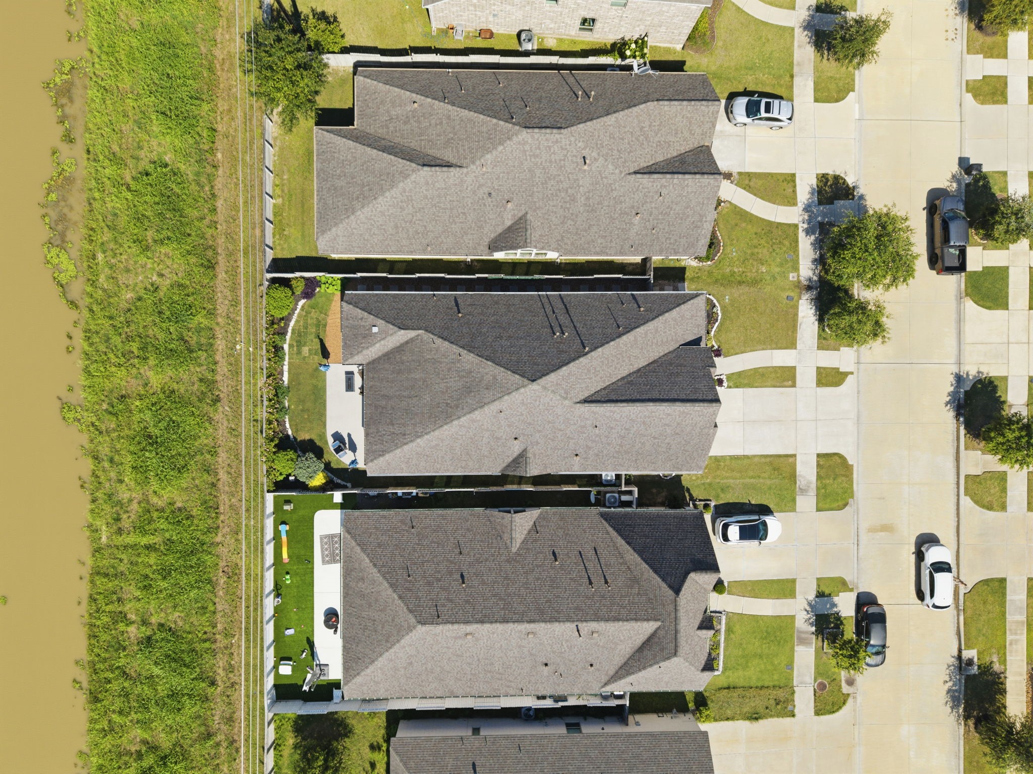 2119 Blackhawk Ridge Lane Manvel, TX 77578 - Photo 38 of 49 Bird's-eye view showcasing the home's prime location backing to a greenbelt/waterway with no rear neighbors — offering exceptional privacy and peaceful backyard views not found on every lot.