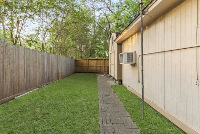 a backyard of a house with lots of green space