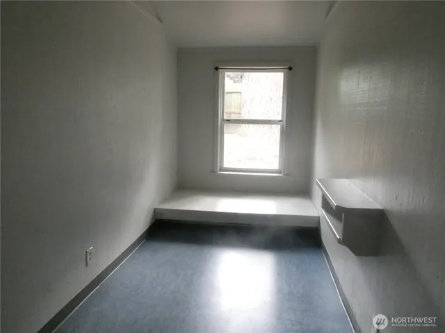 an empty room with windows