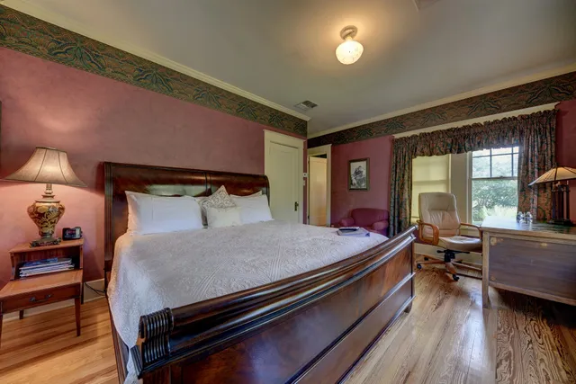 a bed room with a bed and window