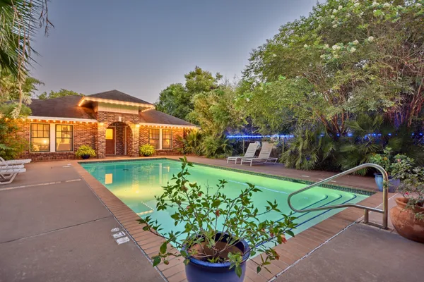 a view of a swimming pool with a patio