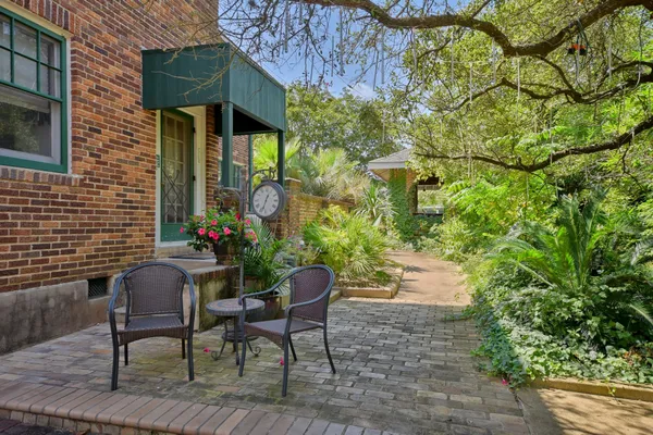 a view of a chairs and table in the patio