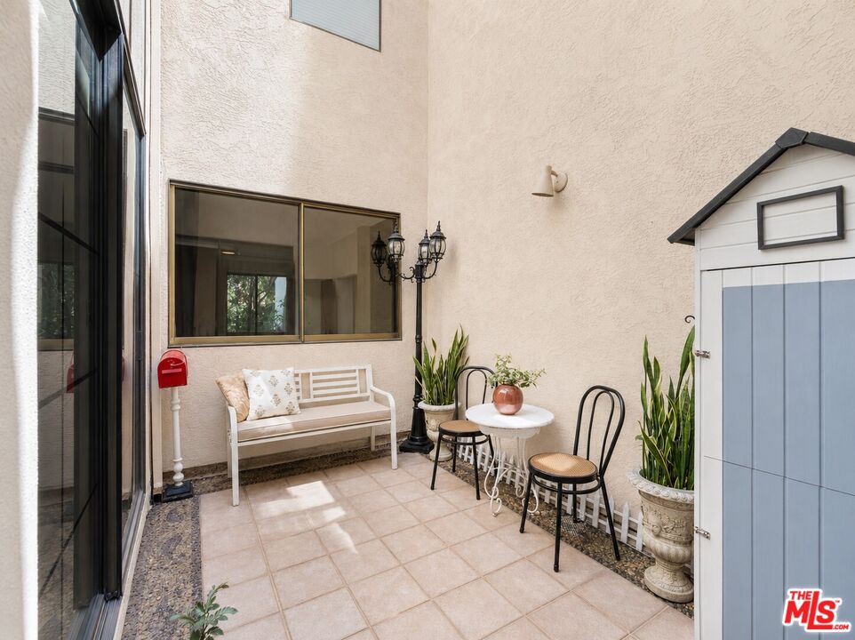 1114 Las Riendas Way Pasadena, CA 91107 - Photo 6 of 20 a view of a patio with a table and chairs and a couch
