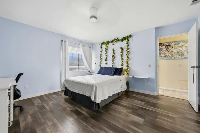 a bedroom with a bed and a table