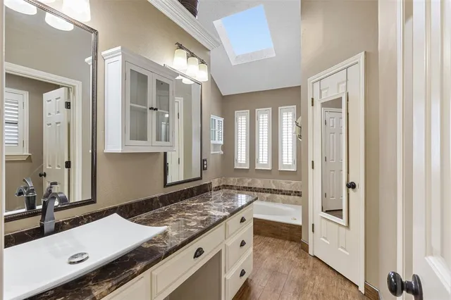 a bathroom with a sink and a mirror
