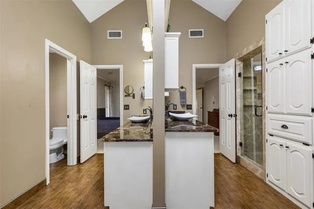 a kitchen with a refrigerator and a sink