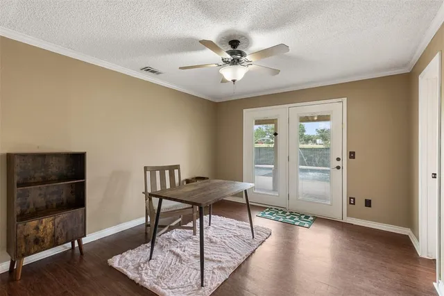 a view of a livingroom with furniture and hardwood floor