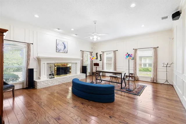 a living room with furniture and a fireplace