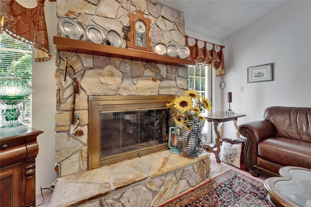 11120 Lu Wista Road Brooksville, FL 34601 - Photo 18 of 50 a bedroom with a bed and a fireplace