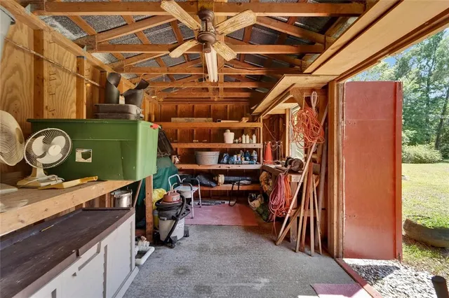 a view of a house with backyard and garden