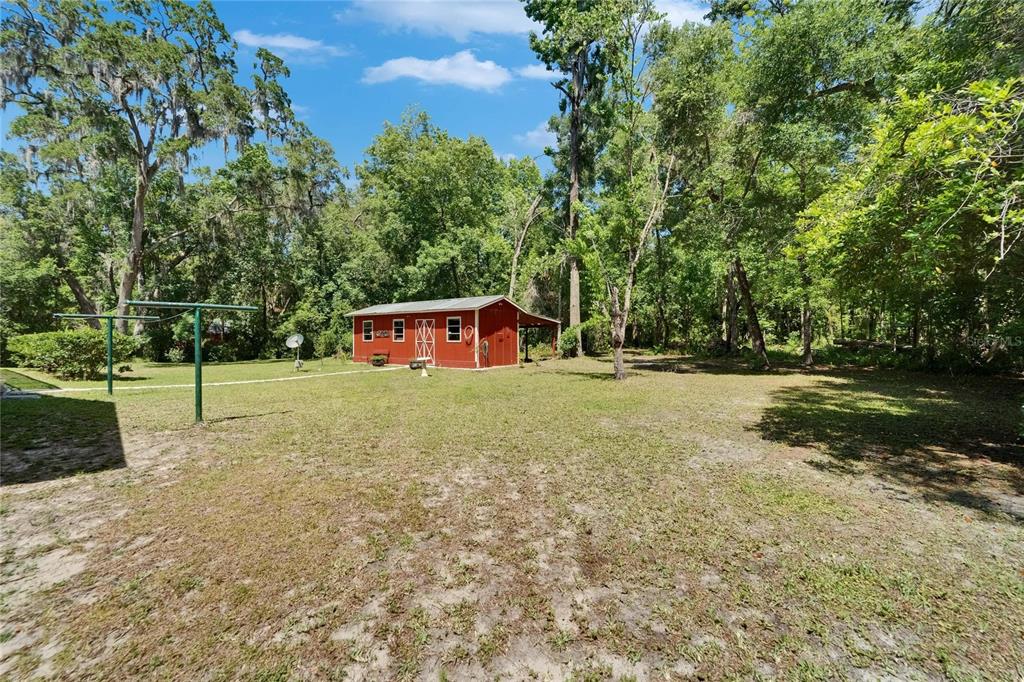 11120 Lu Wista Road Brooksville, FL 34601 - Photo 39 of 50 a house view with a backyard space