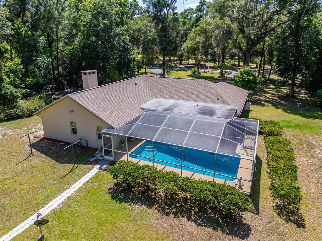 11120 Lu Wista Road Brooksville, FL 34601 - Photo 40 of 50 an aerial view of a house with a yard basket ball court and outdoor seating