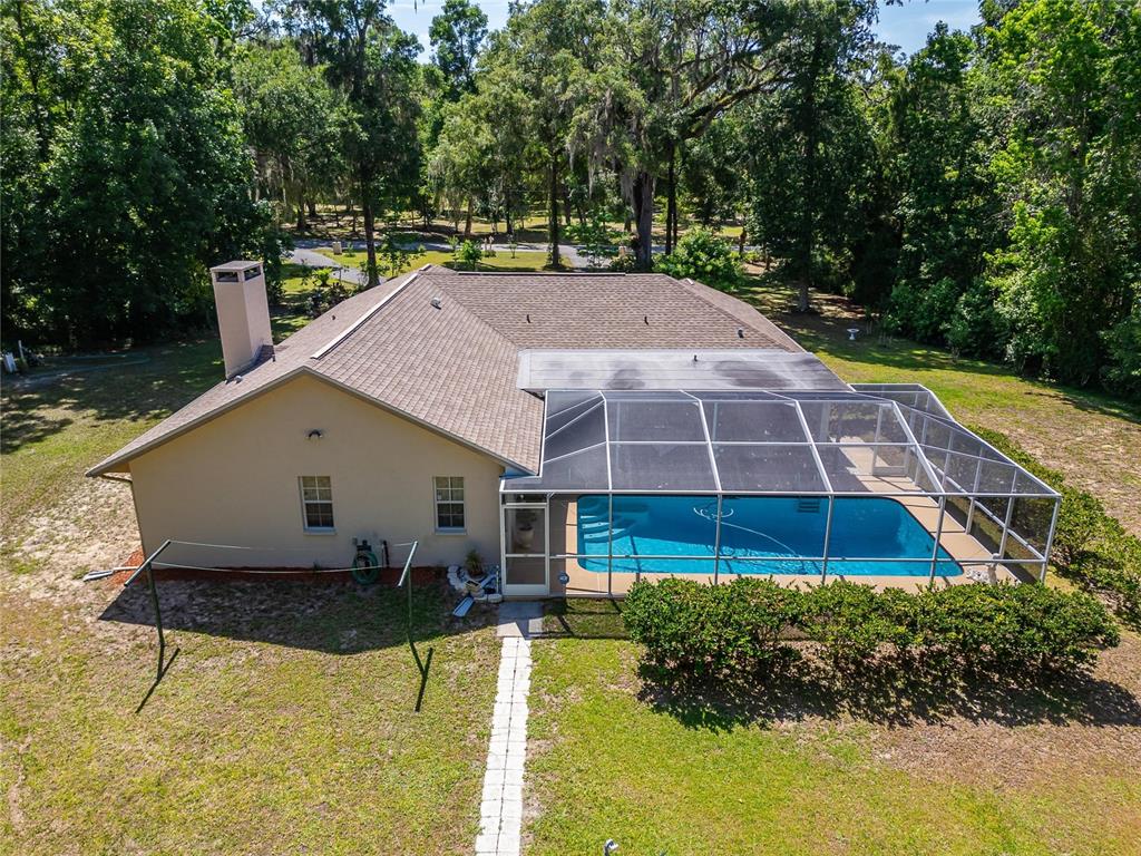 11120 Lu Wista Road Brooksville, FL 34601 - Photo 41 of 50 a front view of house with yard and green space