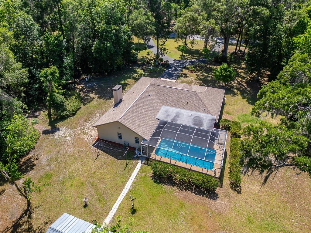 11120 Lu Wista Road Brooksville, FL 34601 - Photo 43 of 50 an aerial view of a house with a yard