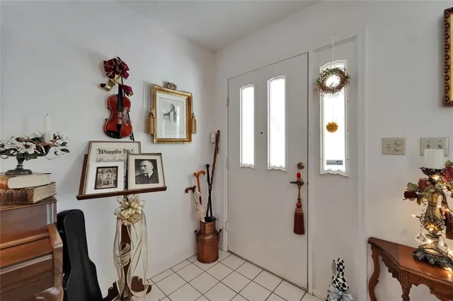 a view of a livingroom with furniture and hardwood floor