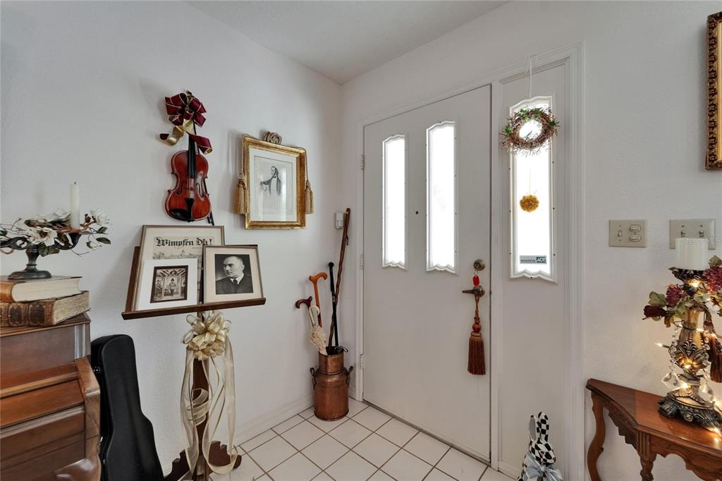 11120 Lu Wista Road Brooksville, FL 34601 - Photo 6 of 50 a view of a livingroom with furniture and hardwood floor