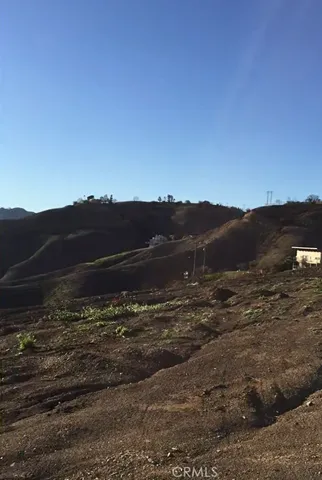 a view of an ocean beach and mountain