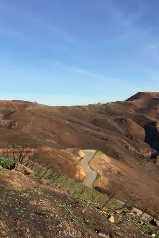 a view of mountain view with mountains in the background