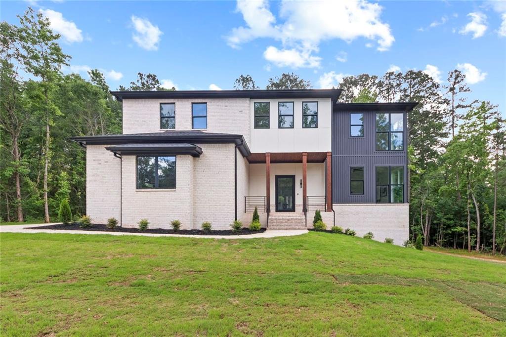 7066 Bells Way Fairburn, GA 30213 - Photo 1 of 64 a view of a house with a yard