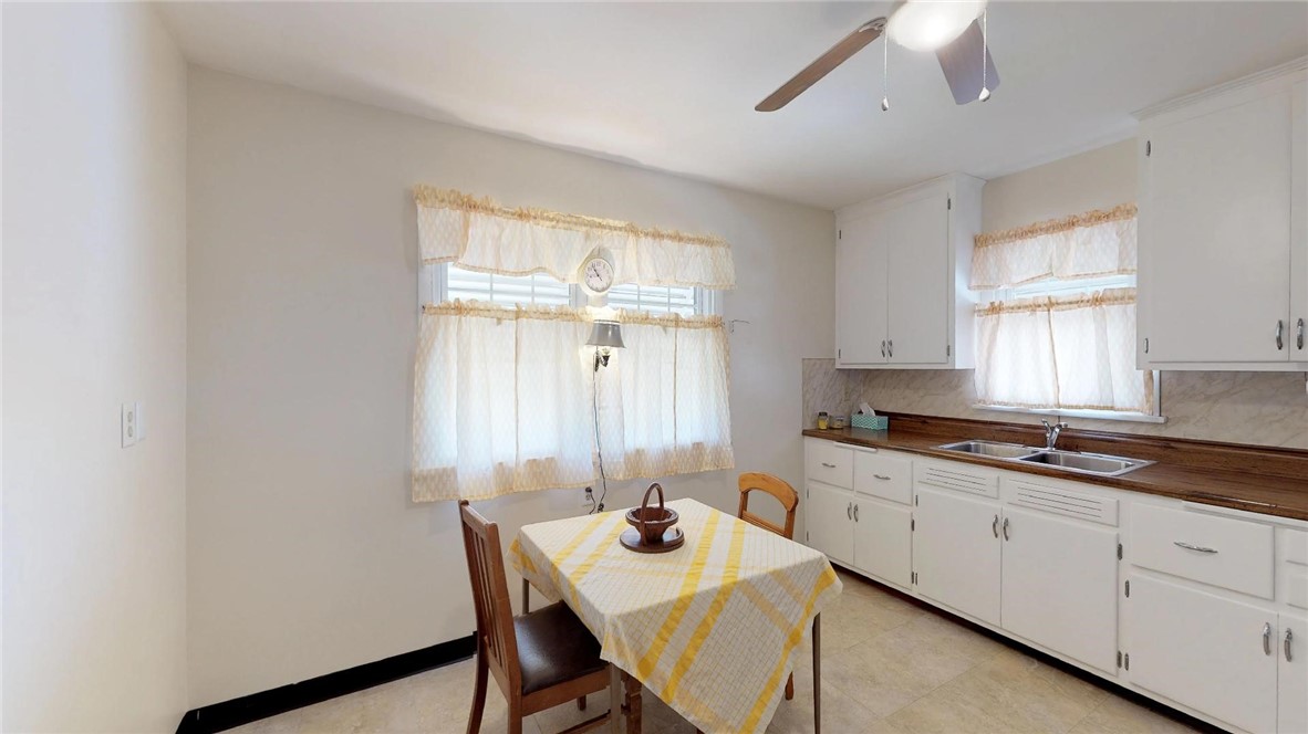 9 Maple Court Decatur, IL 62526 - Photo 8 of 25 a kitchen with a sink cabinets and window