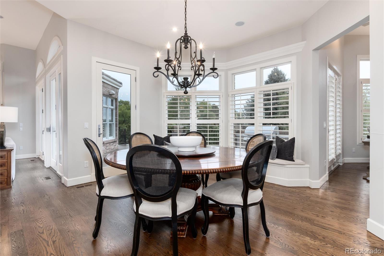 7175 Polo Ridge Drive Littleton, CO 80128 - Photo 13 of 50 a view of a dining room with furniture window and outside view