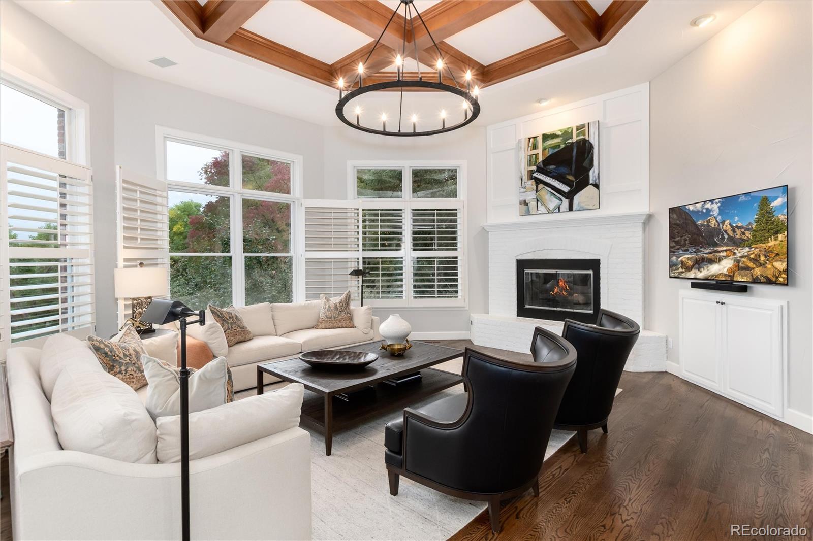 7175 Polo Ridge Drive Littleton, CO 80128 - Photo 15 of 50 a living room with furniture a fireplace and a large window