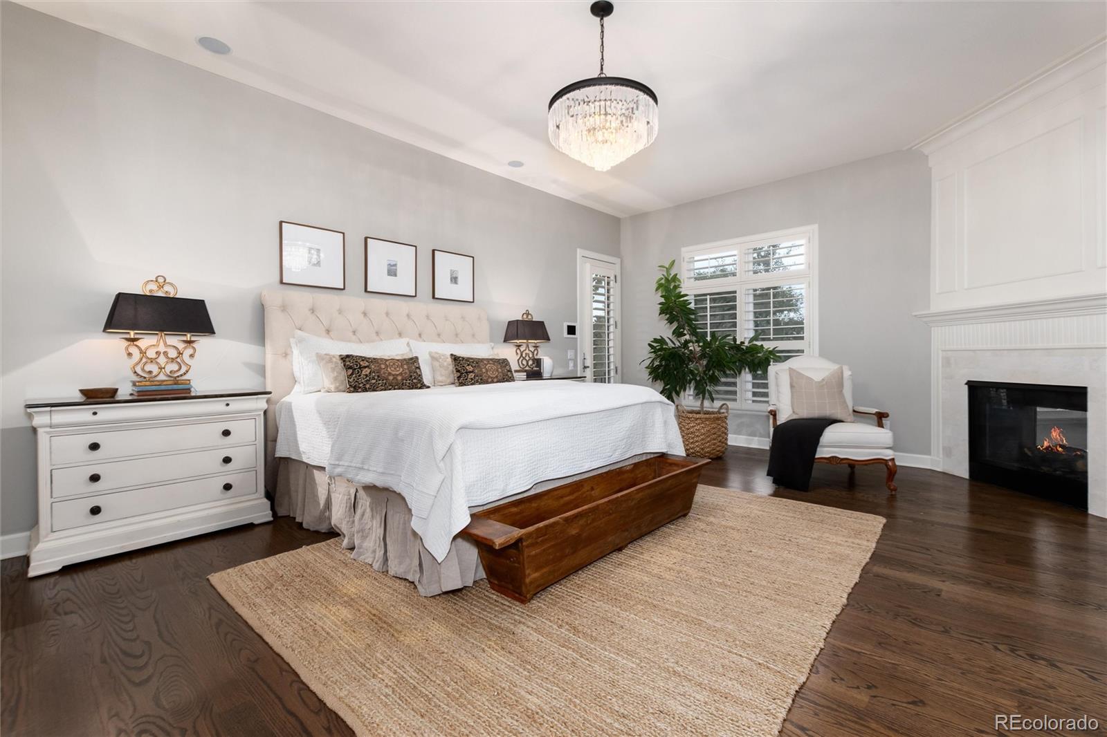 7175 Polo Ridge Drive Littleton, CO 80128 - Photo 23 of 50 a bedroom with a large bed and a couch