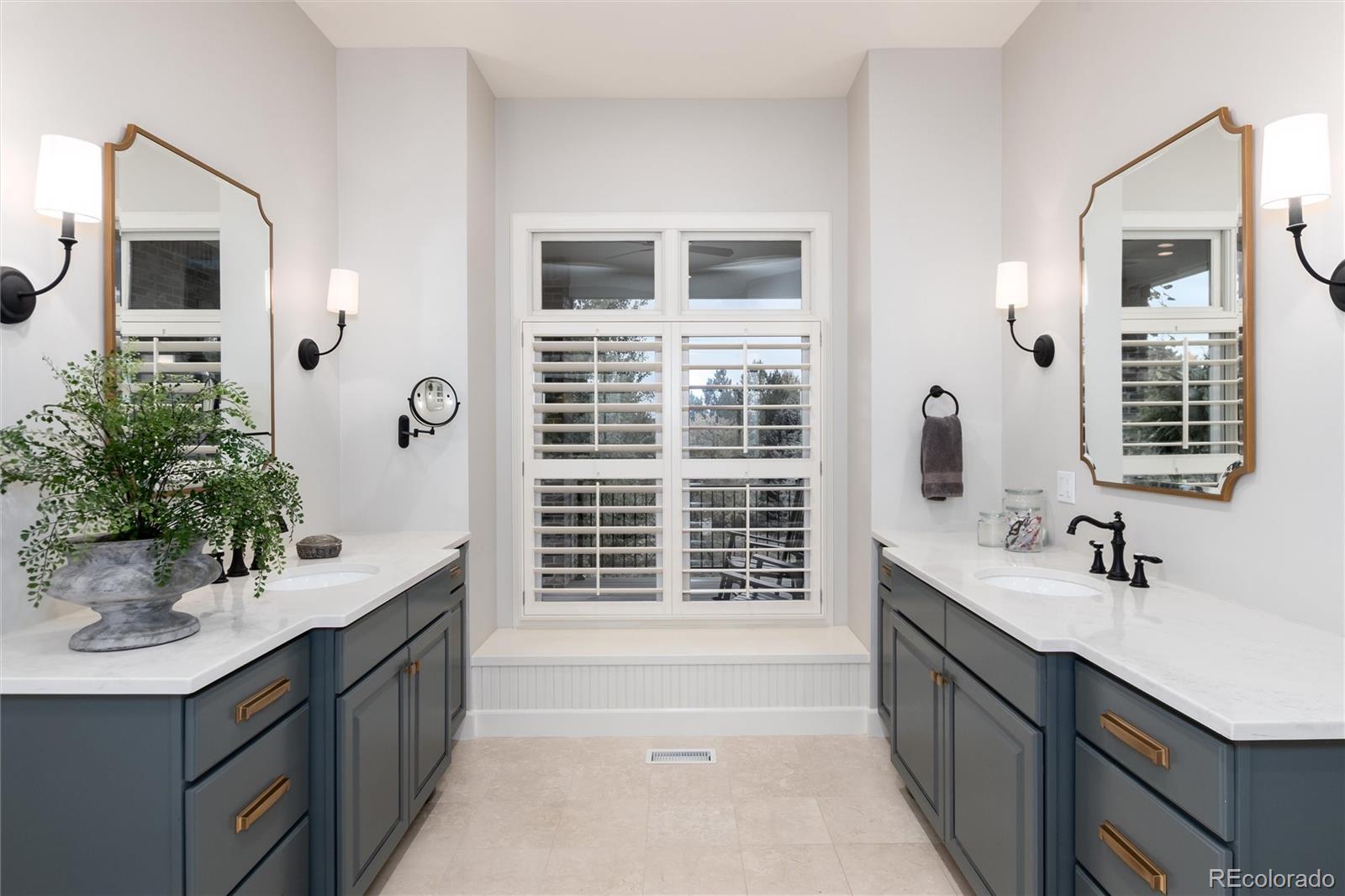 7175 Polo Ridge Drive Littleton, CO 80128 - Photo 24 of 50 a bathroom with a sink double vanity and a mirror