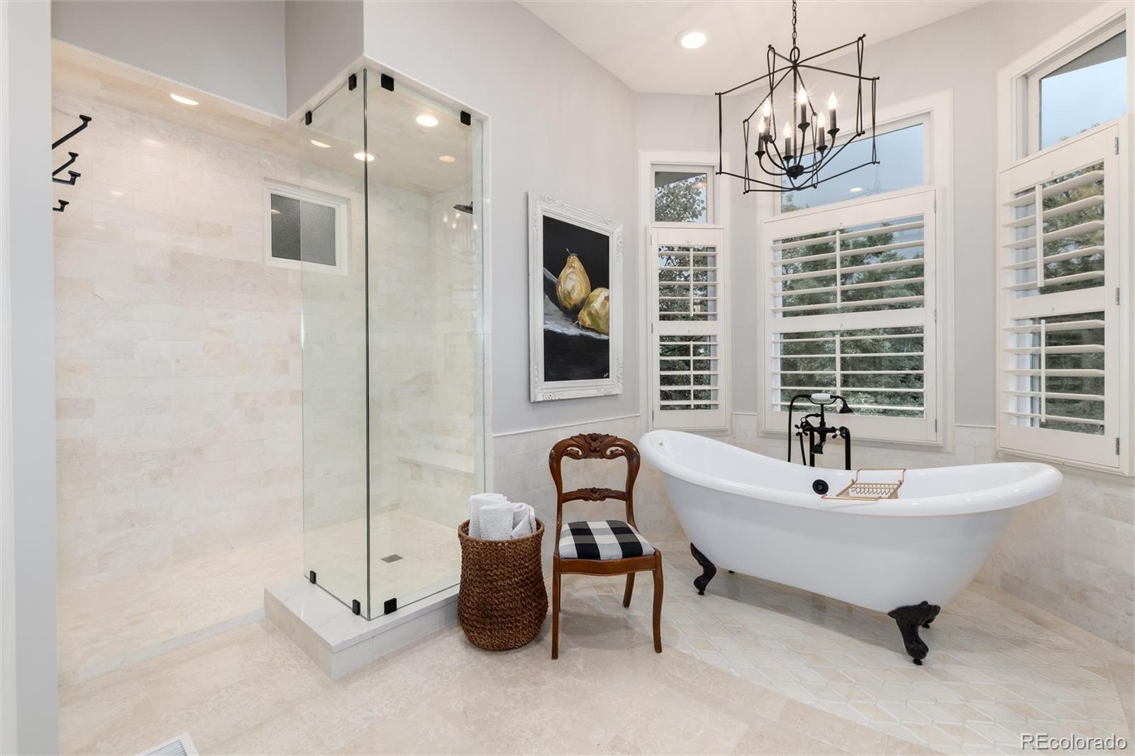 7175 Polo Ridge Drive Littleton, CO 80128 - Photo 25 of 50 a spacious bathroom with a bathtub and shower