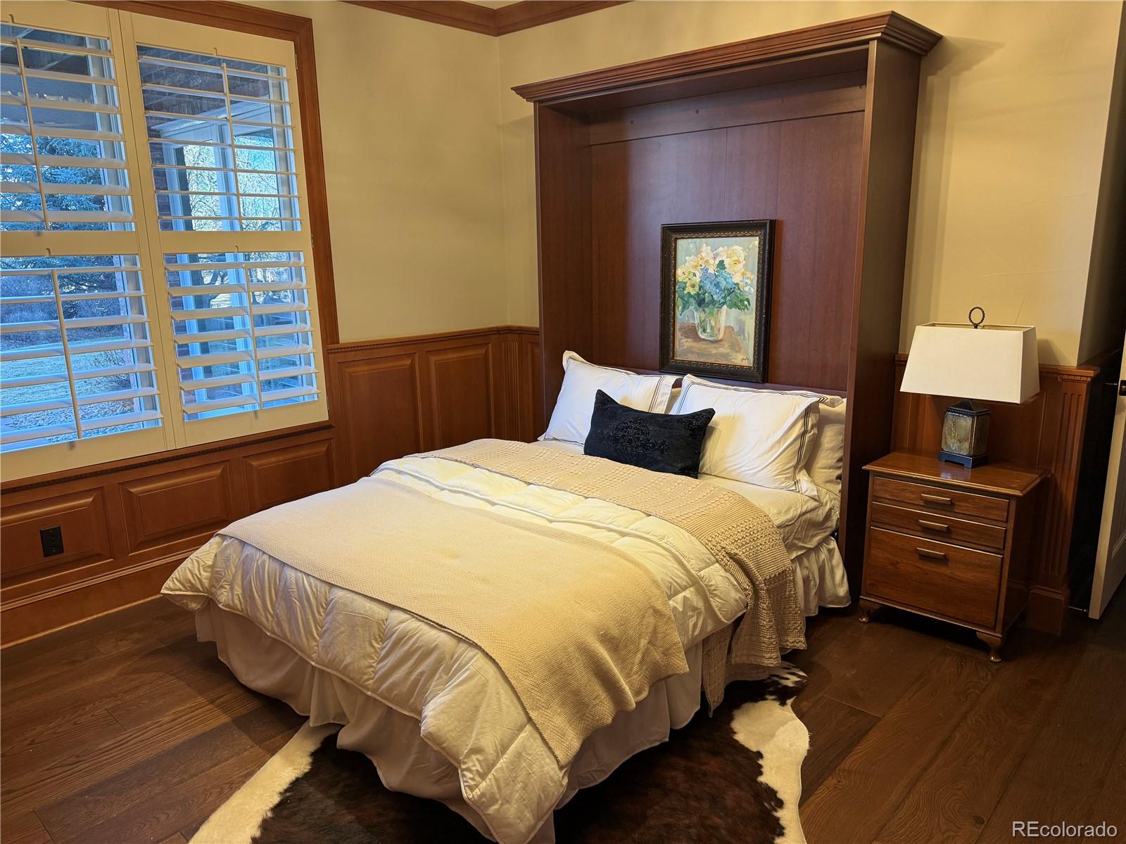 7175 Polo Ridge Drive Littleton, CO 80128 - Photo 34 of 50 a bedroom with a bed and a window