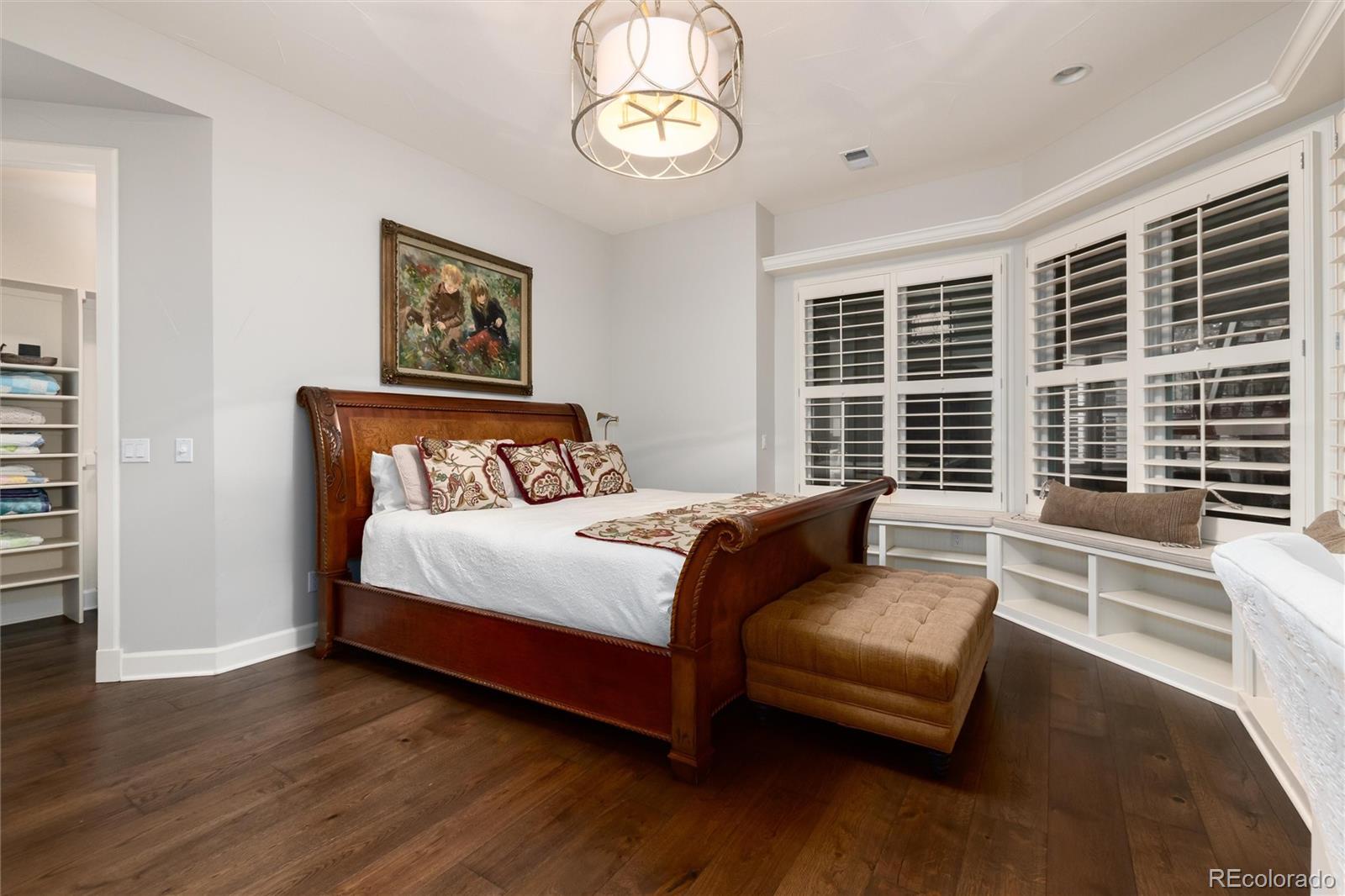 7175 Polo Ridge Drive Littleton, CO 80128 - Photo 35 of 50 a bedroom with a bed and a large window